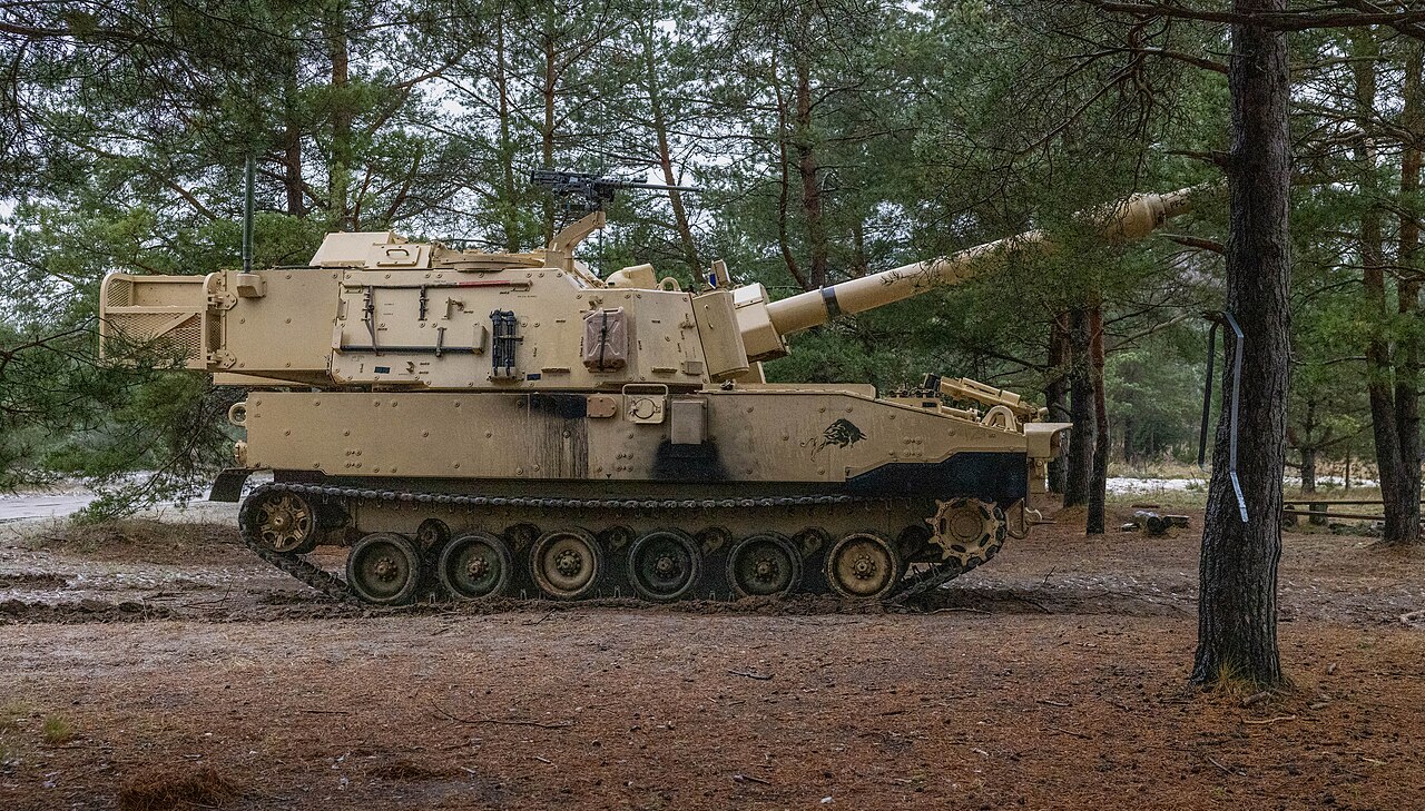Soldiers of the 2nd Battalion, 82nd Field Artillery Regiment set up a firing position with an M109A7 Paladin self-propelled howitzer.