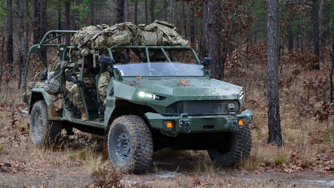Army Infantry Squad Vehicle in a wooded training area