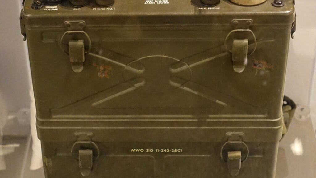 Olive-drab SCR-300 backpack radio on museum display
