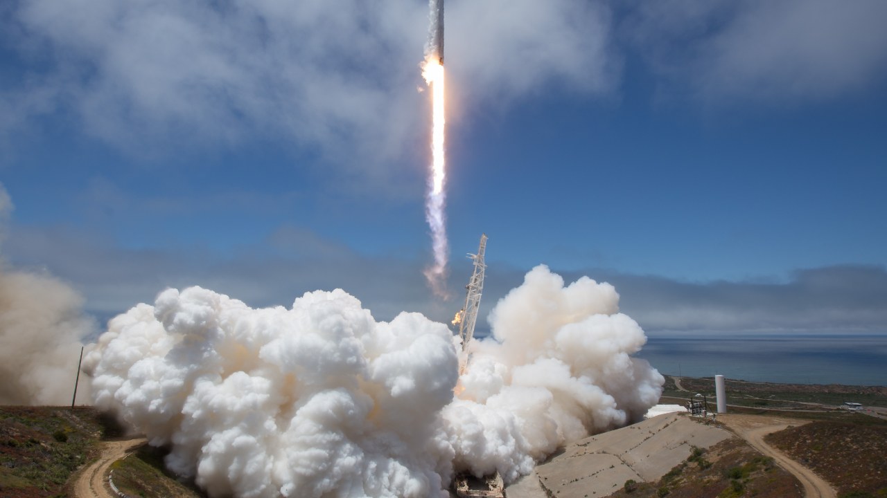 Falcon 9 rocket launching from Vandenberg with exhaust cloud