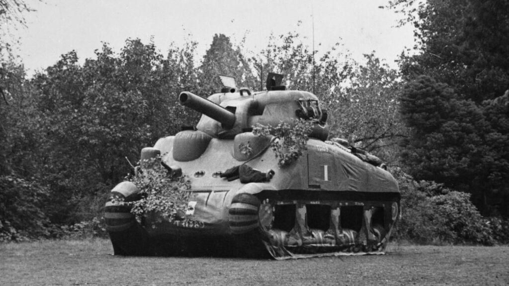 Inflatable dummy Sherman tank in woodland, World War II