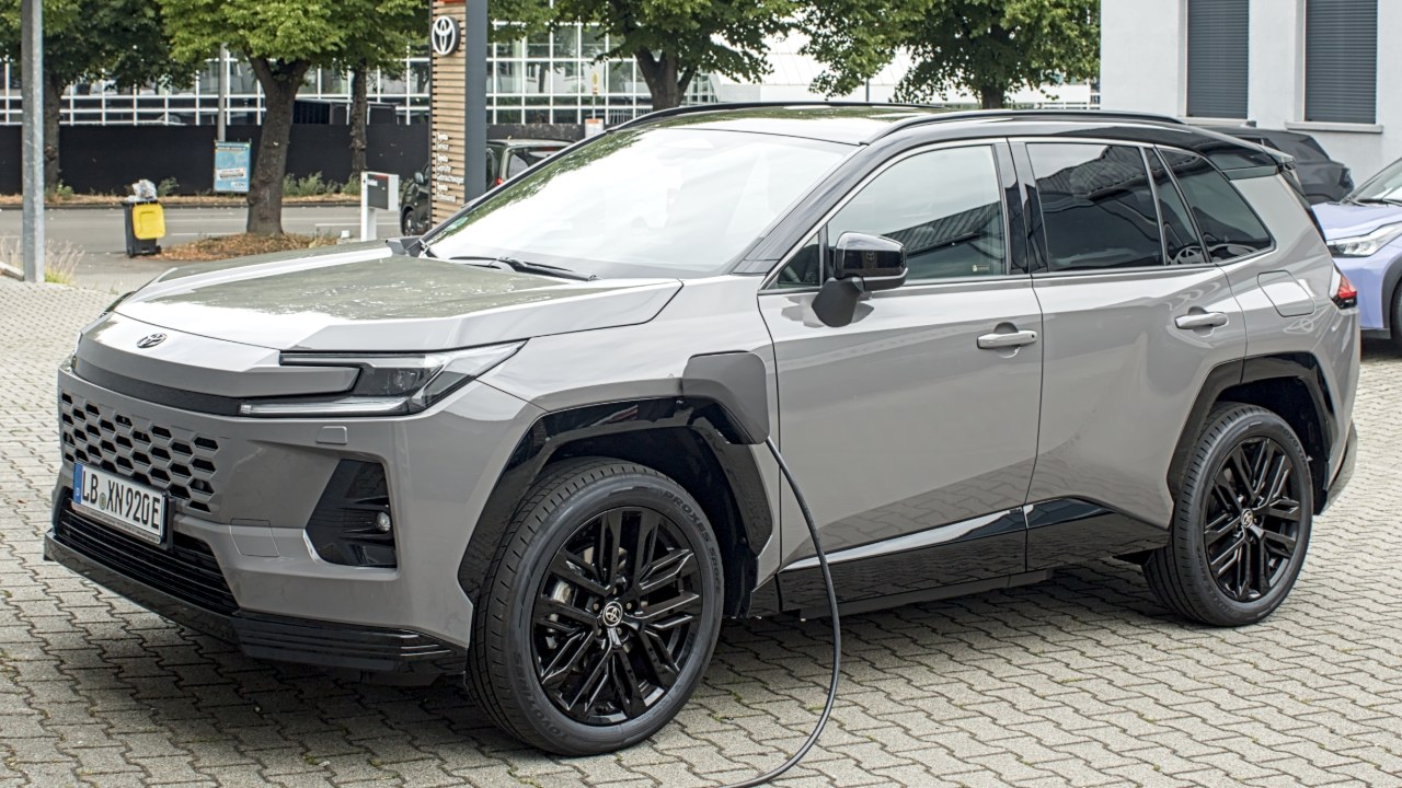 Gray Toyota RAV4 Plug-in Hybrid parked at a charger