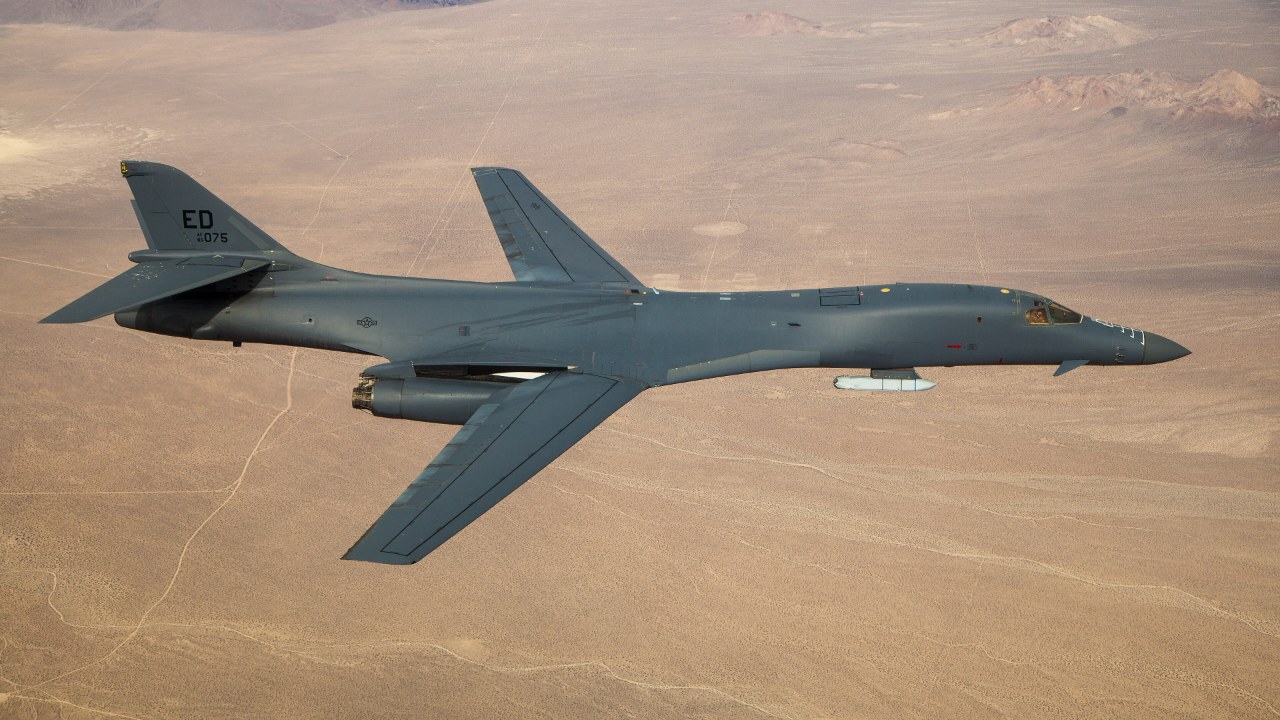 B-1B bomber in flight carrying a cruise missile
