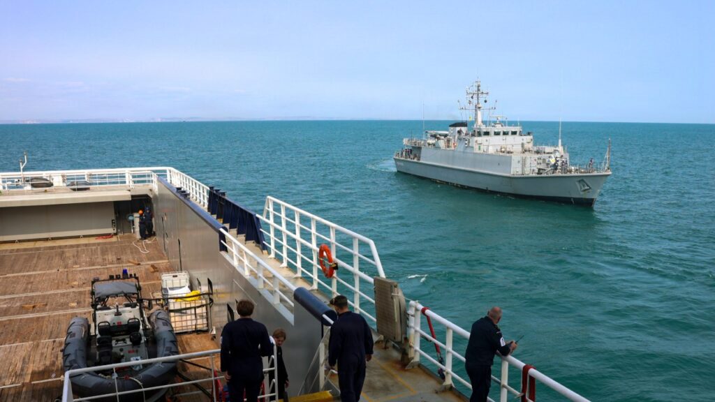 Ukrainian Navy minehunter approaching a Royal Navy support ship