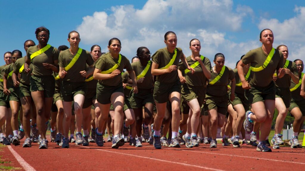 Marine recruits running on a track