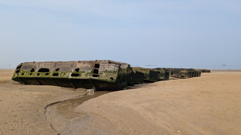 Concrete Mulberry harbour caissons on the beach at Arromanches