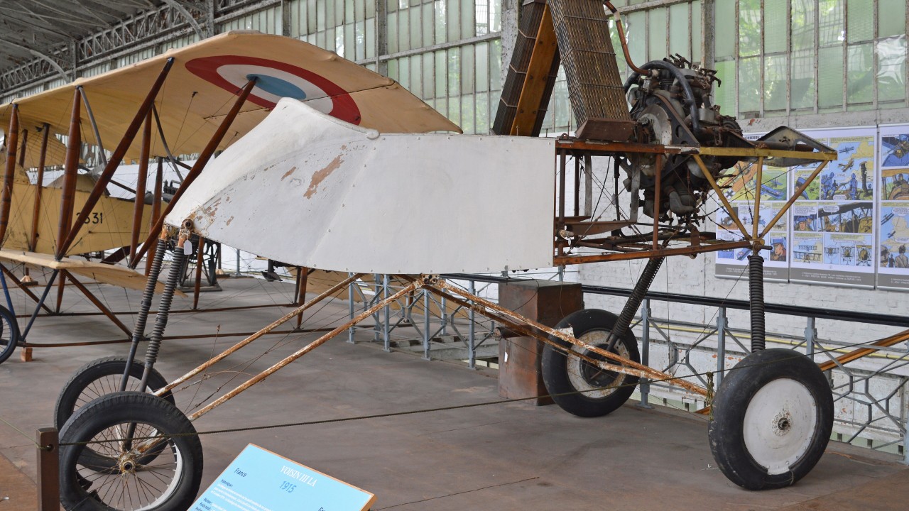 Voisin III pusher biplane on display in a museum hangar