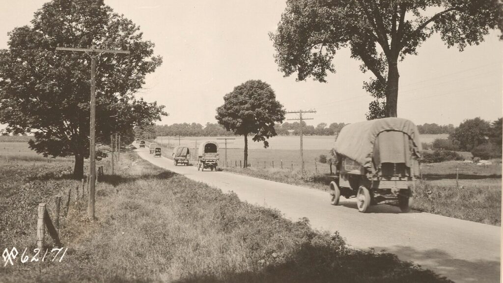 Army truck on a tree-lined road during the 1919 transcontinental convoy