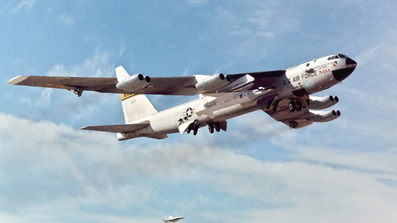 NASA B-52B in flight carrying the X-43A and Pegasus rocket under its wing