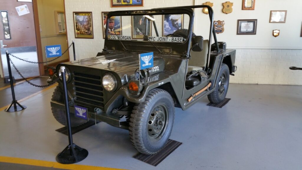Olive drab M151 MUTT military utility vehicle on museum display