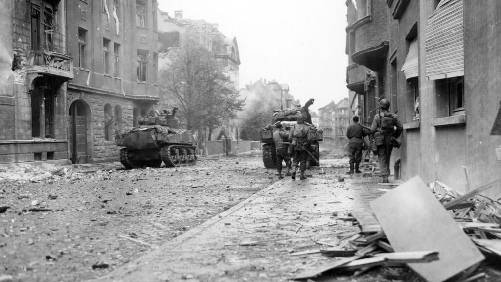 American infantry and tanks in a ruined Aachen street, 1944