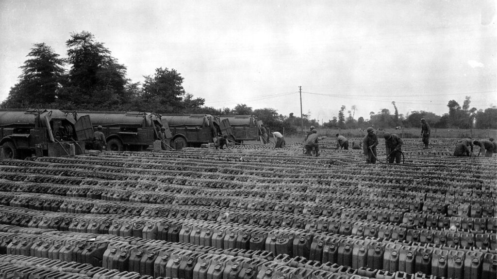Rows of jerricans being refilled at a World War II fuel point