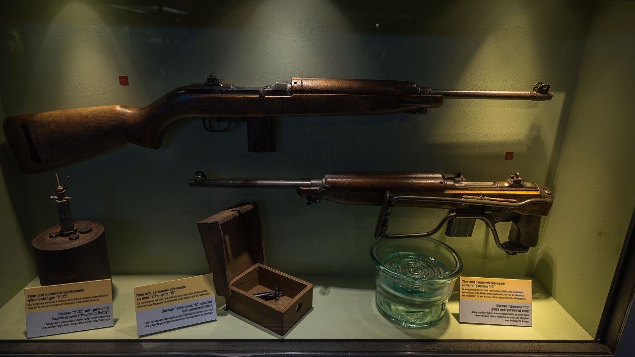 An M1 carbine displayed in a museum case