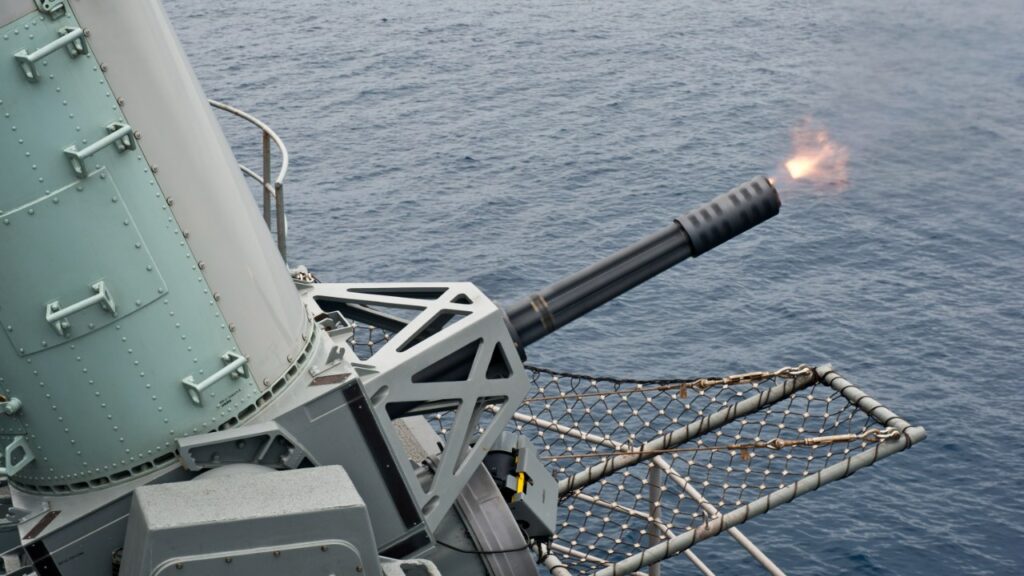 A Phalanx close-in weapon system fires aboard USS Nimitz in the Pacific, May 2013.