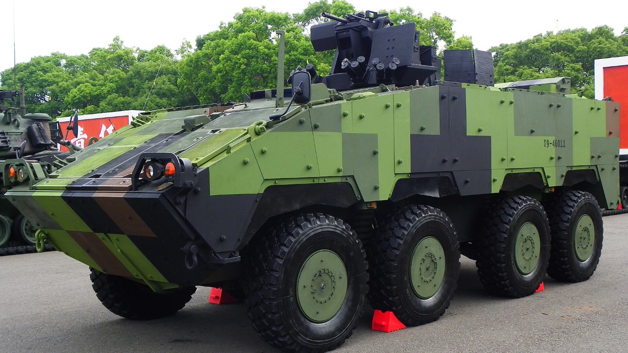 A green camouflaged eight-wheeled CM-32 armored vehicle on display